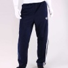 Let a classic pair of track pants complete your look. The men's adidas Originals Adi-Icon Pants do just that with the iconic 3-Stripes on the legs, front zip pockets and a drawcord waist.. 87% Polyester, 13% Cotton. Machine Wash. Imported.