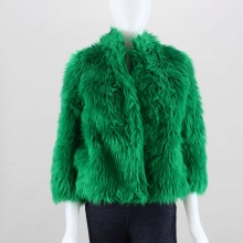 Go green this winter in this wild faux fur coat from Iron Fist. Features a short collar with hook and eye closure and is lined in light green satin with black polka dot contrast print. Finished with a straight cut and falls just below the waist. 100% Acrylic. Dry clean only. Imported.