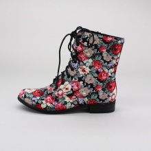 Have some summer fun in these ankle booties. These women's boots feature a rose print upper, round toe, lace up front and finished with a side zipper closure. Imported.