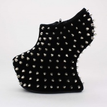 This spiked creation features a 2.5"  platform and all over spike detail. Heelless look with a more balanced heel so that it is not difficult to walk in. Synthetic upper. Imported.