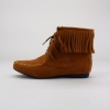 Slip into these cozy and stylish mocassin booties. These round toe fringed booties feature a lace-up closure, synthetic suede upper and stitching detail along the toe. Imported.