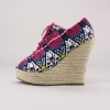 Add some extra flavor to your wardrobe in these fun espadrille wedges. Features a printed canvas upper, front lace closure, peep toe & espadrille covered balance. 1"  Platform & 5"  Heel. Imported.