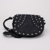 Shiny metal studs add a bit of bling to this small crossbody purse.