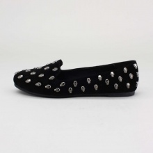 Draw attention to your wild style with these awesome studded loafer flats! Features a leatherette upper, skull stud embellishment throughout, round toe, stitching details, cushioned insole and easy slip on style. Imported.