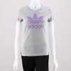 This classic women's adidas Originals Trefoil Tee shirt rates high in both style and comfort categories. Featuring a ribbed crewneck, cap sleeves & a shaped feminine fit. 100% Cotton. Machine wash. Imported.