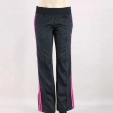 Perfect for warming up, cooling down and taking part in all the action, the Nike Striker Women's Track Pants are made with comfortable fabric in an athletic fit. Features a ribbed elastic waistband with internal drawcord, front welt pockets, and lower leg zips. Front pintucking and contrasting tape down the sides add extra style. 100% Polyester. Machine Wash. Imported.