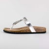 Mixing an old style bottom with a new style top, this molded footbed sandal features metallic and beaded detail.