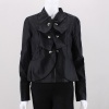 This leatherette jacket is framed with a fancy ruffle front in this chic, fitted design.