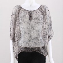 Add some spice to your plain shirt and create a daring new look with this sheer peasant top from Umgee.