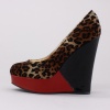 Smooth velvet upper in a platform wedge pump style with a soft rounded toe, smooth lining and footbed.