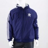 The men's adidas Originals Balance Reversible Jacket is two styles rolled into one. The '90s-style jacket features a reversible design with nylon and contrast 3-Stripes on one side and a large Trefoil embroidered on the other, fleece side. Side 1: 100% nylon plain weave; Side 2: 55% cotton / 45% polyester fleece. Imported.