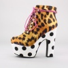 Make a strong fashion statement with these unique platform booties from Iron Fist. These distinctive booties feature a printed textile upper, lace-up closure with metal lace hardware, 2"  platform and 6"  heel. Imported.